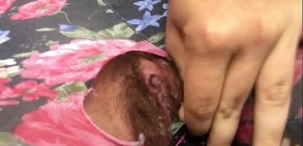  Ripped hole reveals a pissing and squirting little pussy